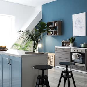 Interior of modern kitchen with blue walls