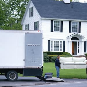Movers loading furniture in truck