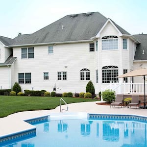 large house with pool in yard 