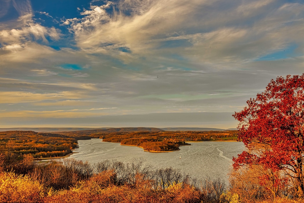 Image shows the Blue Marsh Lake reservoir during autumn with scenario in the background