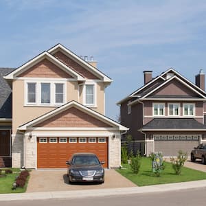 Brand new two-story suburban house in sunny summer afternoon with orange garage door