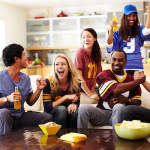 friends watching game in living room