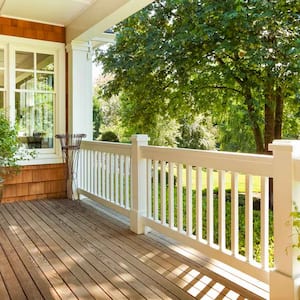 A beautiful wooden deck with white railings