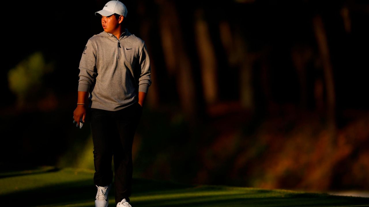 PONTE VEDRA BEACH, FLORIDA - MARCH 09: Tom Kim of South Korea walks up the tenth hole during the first round of THE PLAYERS Championship on THE PLAYERS Stadium Course at TPC Sawgrass on March 09, 2023 in Ponte Vedra Beach, Florida. (Photo by Jared C. Tilton/Getty Images)