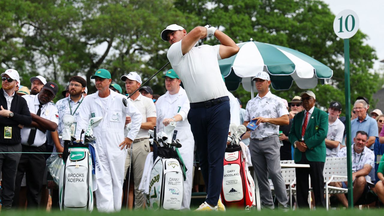 Golf - The Masters - Augusta National Golf Club - Augusta, Georgia, U.S. - April 7, 2023
Brooks Koepka of the U.S. hits his tee shot on the 10th hole during the second round as England's Danny Willett and Gary Woodland of the U.S. look on REUTERS/Mike Segar