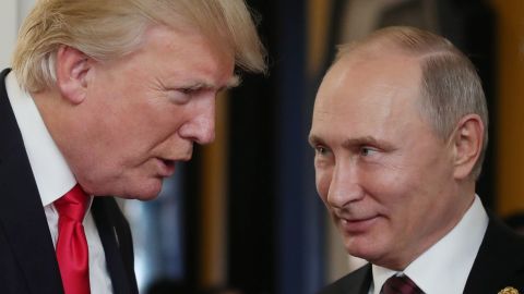 US President Donald Trump (L) chats with Russia's President Vladimir Putin as they attend the APEC Economic Leaders' Meeting, part of the Asia-Pacific Economic Cooperation (APEC) leaders' summit in the central Vietnamese city of Danang on November 11, 2017. (Photo by Mikhail KLIMENTYEV / SPUTNIK / AFP) (Photo by MIKHAIL KLIMENTYEV/SPUTNIK/AFP via Getty Images)