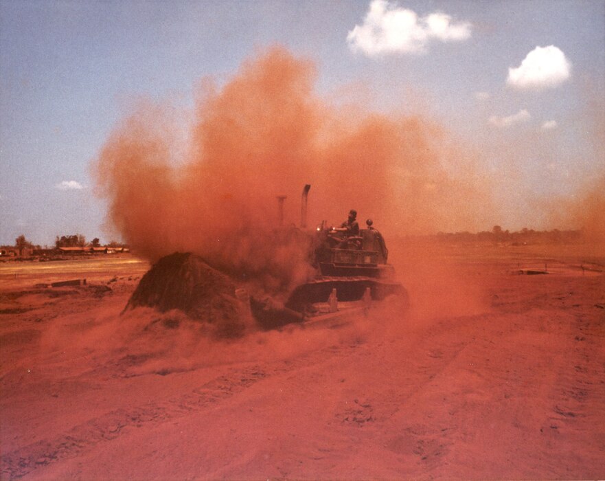 Red dust kicked up by bulldozer
