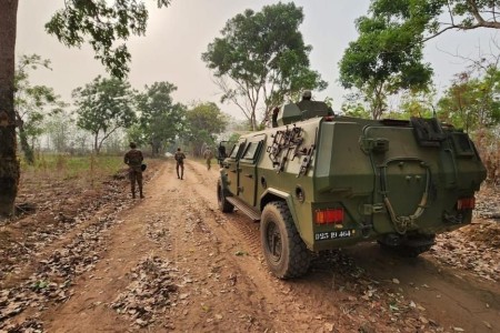 Staff Sgt. Alex Radi, 817th Engineer Company (Sapper), assists Benin Soldiers conducting a Counter-IED mission in Ouassa, Benin, Feb. 16, 2023. The N.D. National Guard Soldier worked with the Benin Soldiers in planning for a practical exercise that incorporated counter-IED mission planning during mounted and dismounted patrols. Radi and Staff Sgt. Dale Burdette, both of the Jamestown-based 817th Engineer Company (Sapper), participated in a knowledge exchange with the Beninese Armed Forces (FAB - Forces armées béninoises) centered on counter–IED (improvised explosive device) training in Benin, Feb. 13 to 17, 2023.