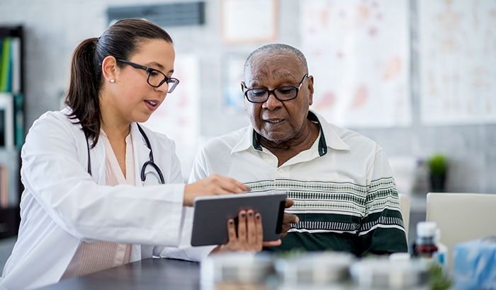 Female health care clinician with male patient.