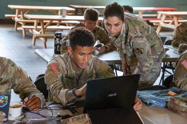 U.S. Army Maj. Nargis Kabiri from the USMA admission team assists a prospective Service-connected Application (SCA) Canidate on their application through the Rapid Application Completion Exercise (RACE) at F-Quad, Schofield Barracks, Hawaii, April 13, 2023. Twenty-one Soldiers completed their application through the RACE process, investing in their future as prospective Army officers.