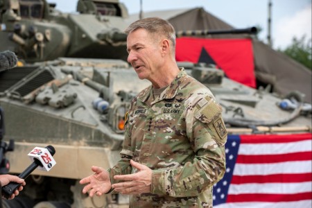 U.S. Army Chief of Staff Gen. James C. McConville speaks with media during his visit to the 3rd (United Kingdom) Division training site for the Warfighter Exercise 23-4, April 20, 2023, at Fort Hood, Texas. WFX 23-4 is a Department of Defense directed multi-echelon, multi-national exercise with III Armored Corps, 1st Armored Division, 1st Cavalry Division, 13th Expeditionary Sustainment Command, 36th Engineer Brigade, 75th Field Artillery Brigade, and 89th Military Police Brigade participating as primary training units. WFX 23-4 is designed to enhance lethality, readiness, and allied interoperability. (U.S. Army photo by Sgt. Luis Santiago)