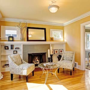 Cozy family room with gold walls and armchairs