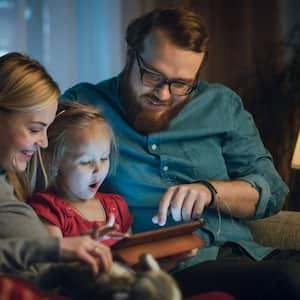 Parents spending leisure time with their daughter 