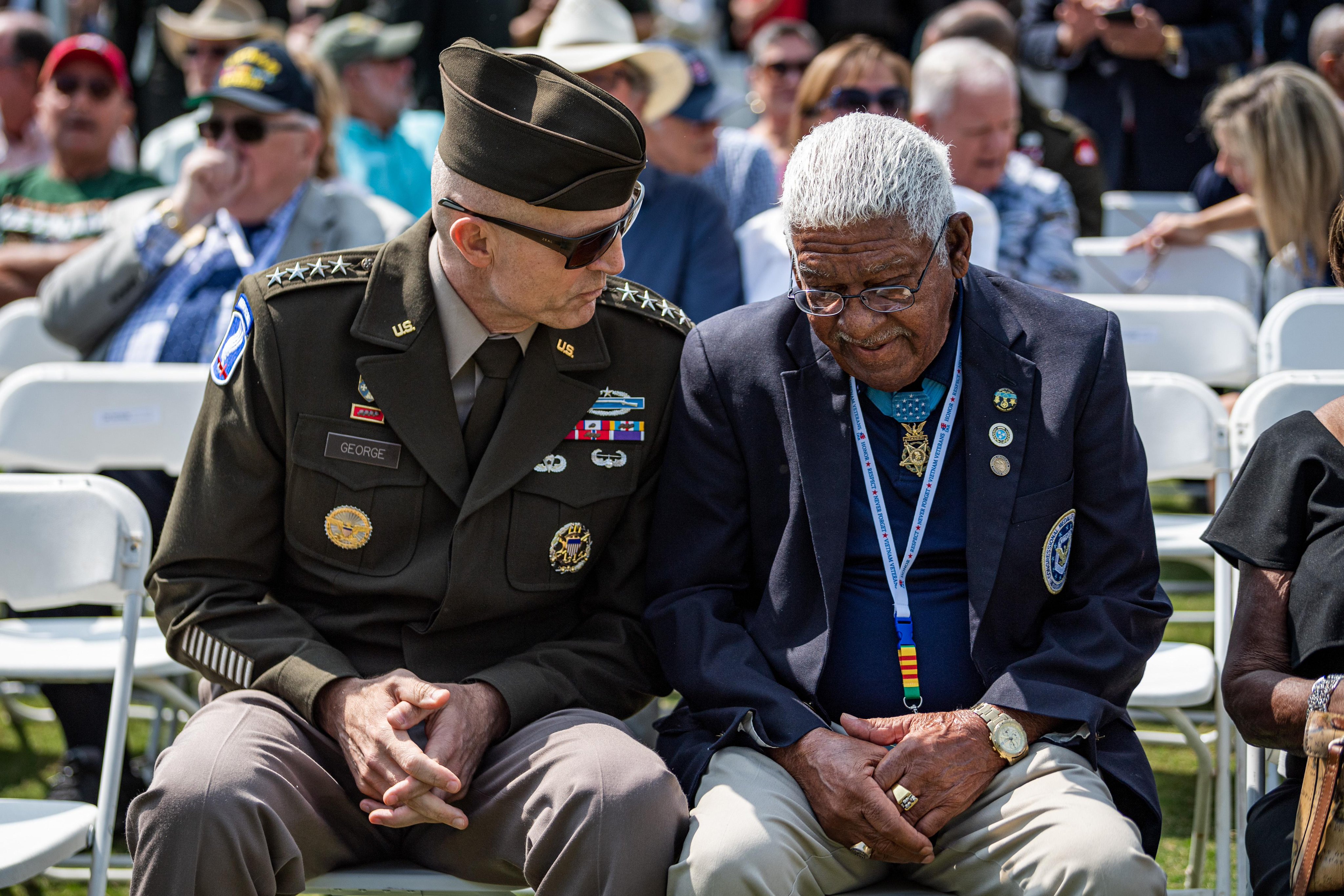 Vice Chief of Staff of the U.S. Army Gen. Randy George speaks with Medal of Honor recipient Melvin Morris during the opening ceremony for the Vietnam Veterans “Welcome Home” Celebration at the west end of JFK Hockey Fields on the National Mall in Washington, D.C.