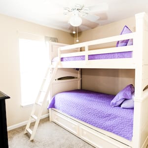 bunk beds with purple bedding