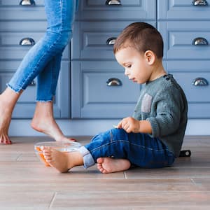 Child plays in kitchen