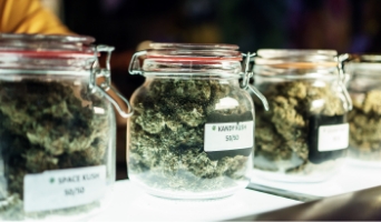 Glass jar of cannabis on shelf