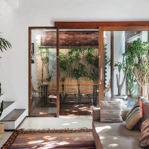 A living room with an ethnic decor and intricate rug