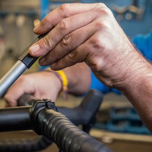 A torque wrench tighting a bicycle handlebar