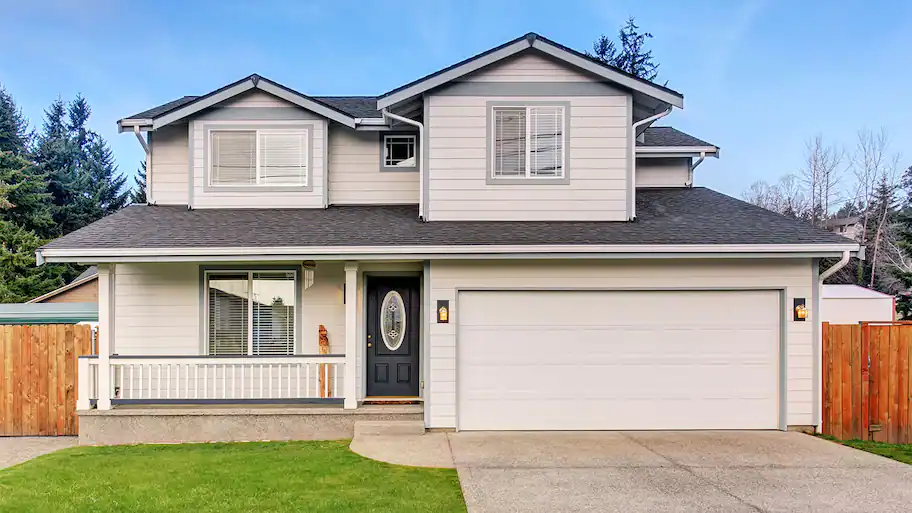 Biege home exterior with driveway