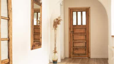 A boho entrance with a retro mirror