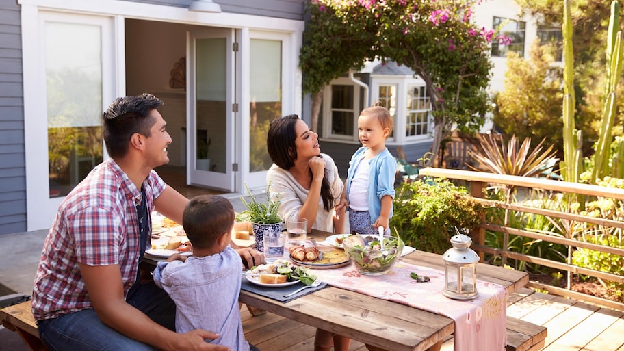 A family enjoying their lunch in the garden