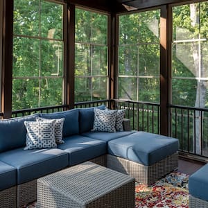 A modern screened patio with furniture