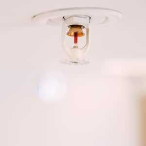 A fire sprinkler system located on the ceiling of a room