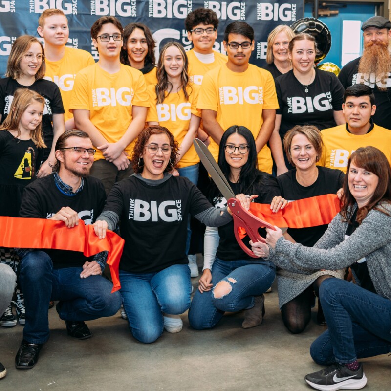 A photo of a group of students and teachers at a ribbon cutting of an AWS Think Big Space in eastern Oregon.