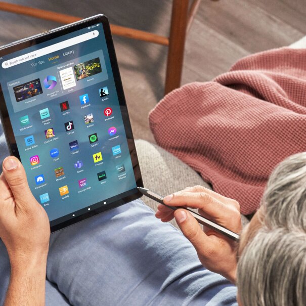 An image of a person using the Amazon's Fire Max 11 tablet.