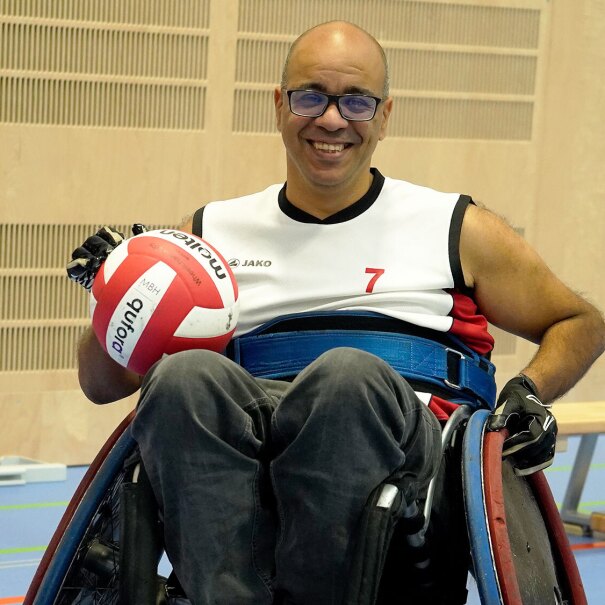 An image of Shadi Abou-Zahra, a principal accessibility standards and policy manager for the Amazon Devices Accessibility team, on a wheelchair and with a ball in his hand. 