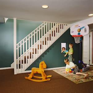 Two children playing in the playroom located in the house’s basement
