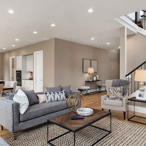 A living room with an open space kitchen