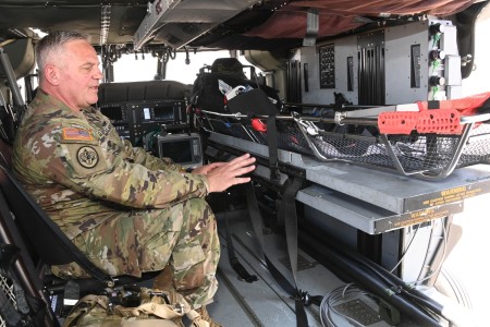 1st Sgt. Patrick Casha, flight paramedic with the Oregon Army National Guard, demonstrates the new MH60M Medical Upgrade Interior (MUI) kit designed for Future Long-Range Assault Aircraft (FLRAA) during EDGE 23 Distinguished Visitor Day at Yuma Proving Ground, Arizona, May 18, 2023.