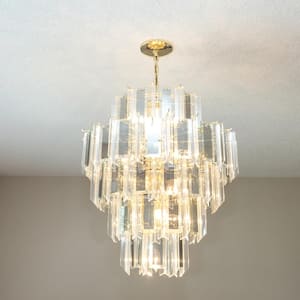 A chandelier hanged from a popcorn ceiling