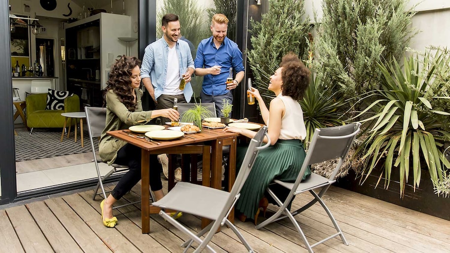 Group of friends having a reunion on the patio