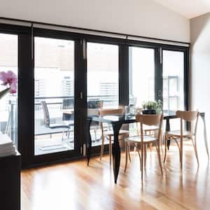 An apartment living room with bifold doors