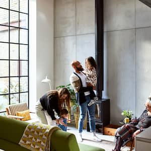 a multi-generational and diverse family enjoys a bright modern living room at home