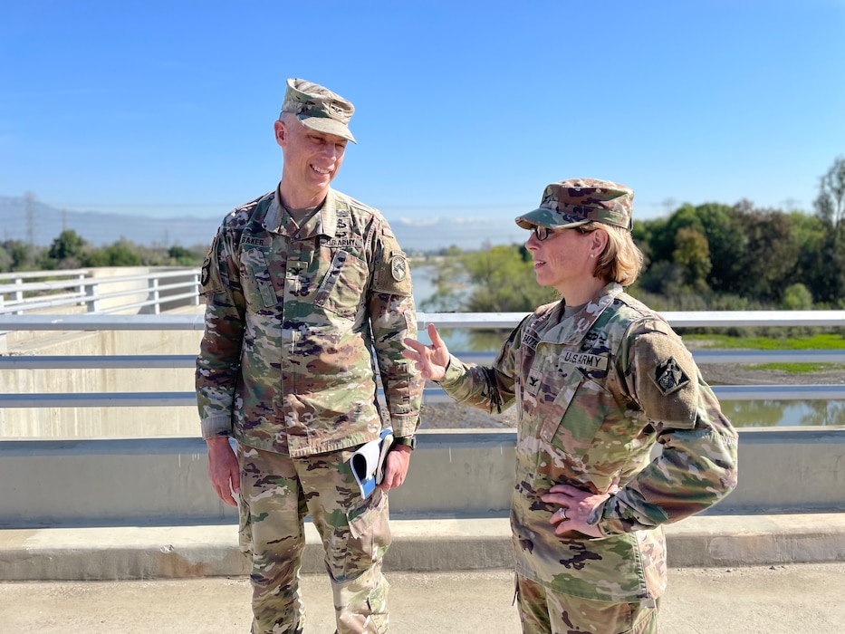 Col. Julie Balten, the U.S. Army Corps of Engineers Los Angeles District commander, right, updates Col. Andrew Baker, who is slated to assume command of the district in July when Balten’s three-year assignment is complete, during an April 7 stop at the San Gabriel River side of the Whittier Narrows Dam in Pico Rivera, California.