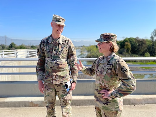 Col. Julie Balten, the U.S. Army Corps of Engineers Los Angeles District commander, right, updates Col. Andrew Baker, who is slated to assume command of the district in July when Balten’s three-year assignment is complete, during an April 7 stop at the San Gabriel River side of the Whittier Narrows Dam in Pico Rivera, California.