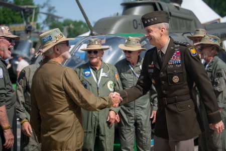 Chief of the National Guard Bureau Gen. Daniel R. Hokanson greets members of the North Carolina Vietnam Helicopter Pilots Association during the Vietnam Veterans “Welcome Home” Celebration at the west end of JFK Hockey Fields on the National Mall in Washington, D.C., May 11, 2023. 