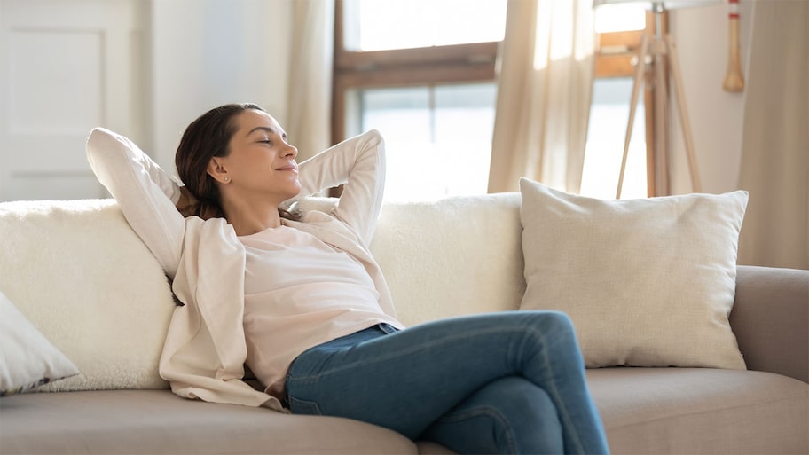 Young woman relaxing in living room