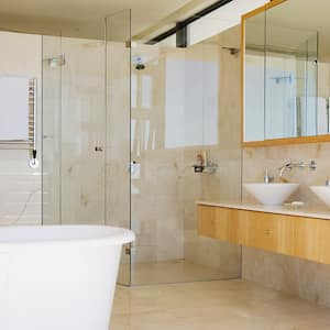 Frameless shower in a an open modern bathroom 