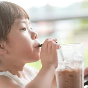 Girl drinking ice cold chocolate milk