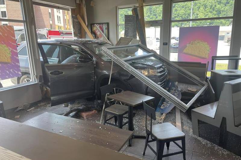 Emergency crews respond Thursday, June 8, after a vehicle crashes into Taco Bell at the...
