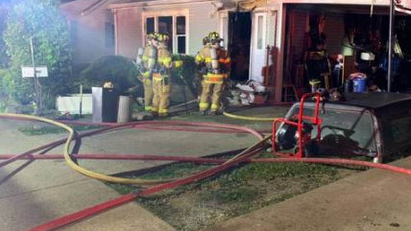 Firefighters with the Ashland Fire Department respond to a house fire along South 29th Street.