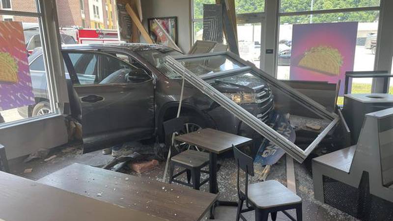 Emergency crews respond Thursday, June 8, after a vehicle crashes into Taco Bell at the...