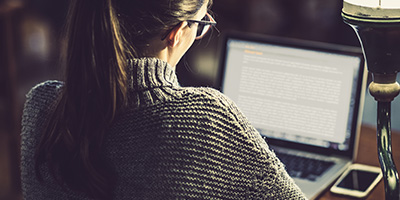 Person reading on a laptop