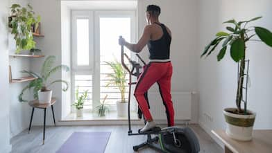 A man using elliptical trainer