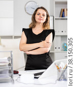 Portrait of female manager standing at her desktop. Стоковое фото, фотограф Яков Филимонов / Фотобанк Лори